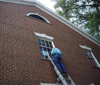 Broken windows in English being repaired. (Bryan Worf)
