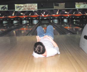 Phil Lundeen rocks out on air guitar in an unfettered celebration of bowling, life, and waxed floors. Games start at 7:00 p.m. on Fridays. (Alice Sharp)