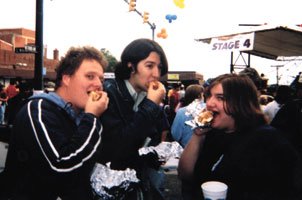 Seniors Bryan Adams, Josh Neas and Ali Kleeb dig in. ()