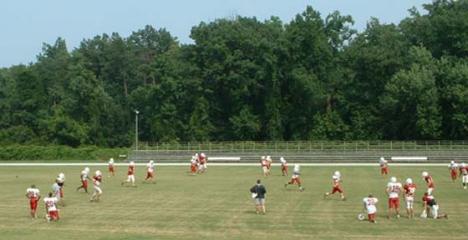 The varsity football team at practice. ()