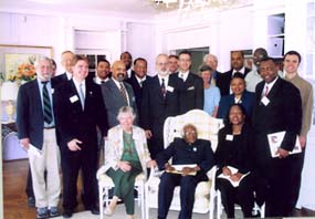 Guilford’s Jeff Thigpen and Scott Pryor, ‘02, with Archbishop Desmond Tutu and the local Truth and Reconciliation task force  (Courtesy of the Truth and Reconciliation Project Headquarters)