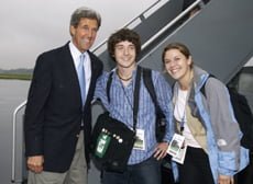 Freedman and sister pose with John Kerry ()