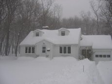 Massachusettes home buried in snow ()