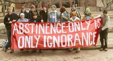 Guilford students at the march with their group banner ()