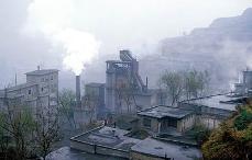 Pollution pours into the atmosphere from factories in a village in northern Guangdong province. (economist.com)