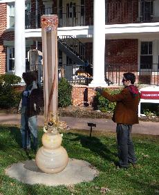 A student admires senior Sam Sklovers 10-foot-tall art installation commemorating Guilfords - hopefully - newly unified community.  ()