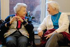 Peggy Baxter (right) sits with Jewell Farlow as they reminisce about their years at Guilford.  The Mary Hobbs Reunion took place April 17 through 19, providing a weekend of joyous reconnection for alumnae. ()