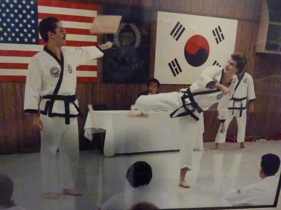 Hildreth, two decades younger, breaks boards at a black belt promotion in which he was attempting a higher degree. (David Hildreth)