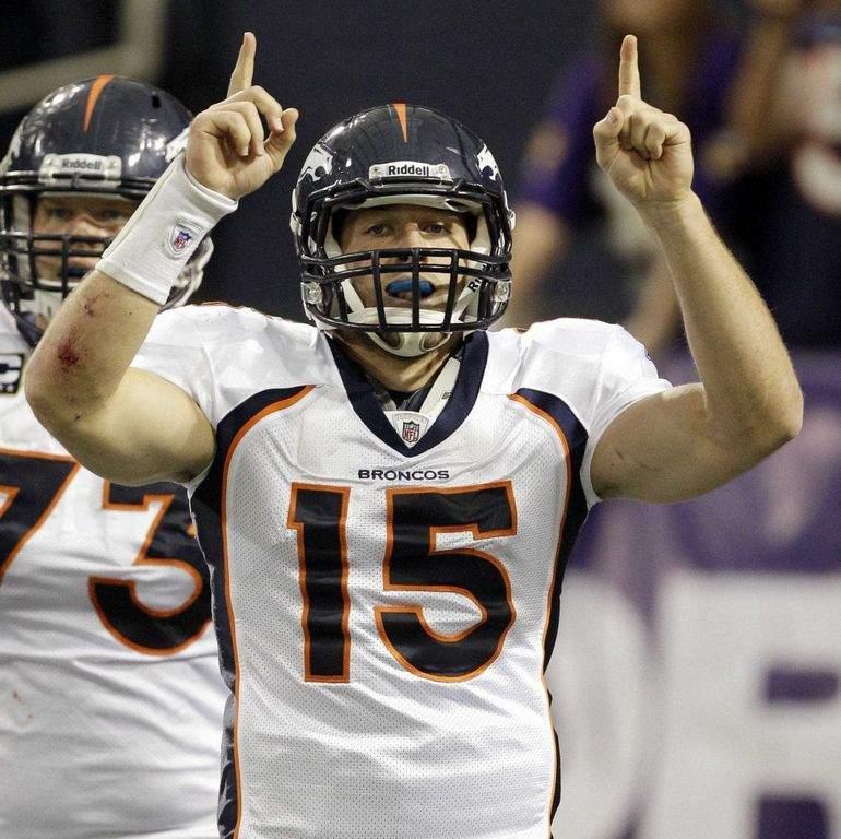 Denver Quarterback Tim Tebow points to the heavens after scoring one of his three rushing TDs of the season. (provided courtesy of detnews.com)