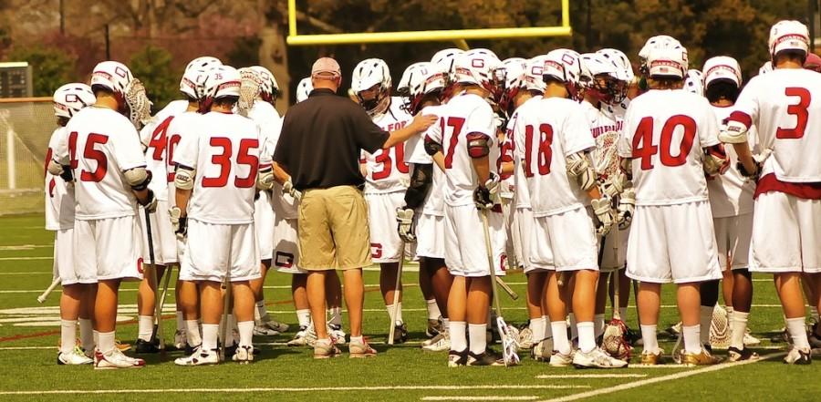 Coach Carmean discusses strategy with his team