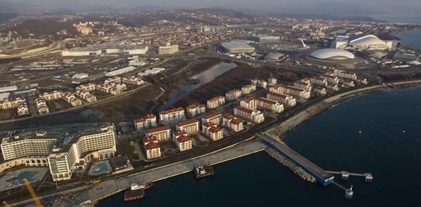 An aerial view from a helicopter shows the Olympic Park under construction and the Olympic Village in the Adler district of the Black Sea resort city of Sochi