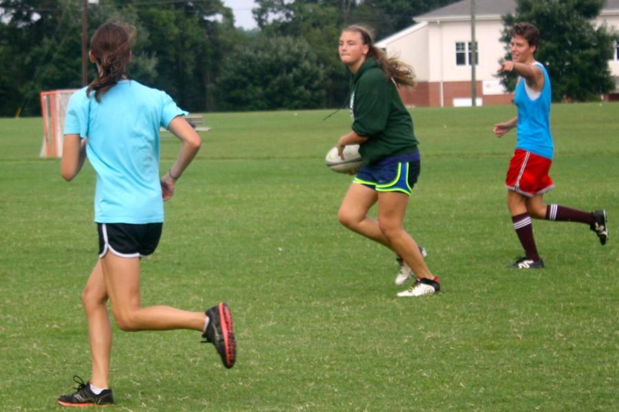 Rugby players ruck through rainy season