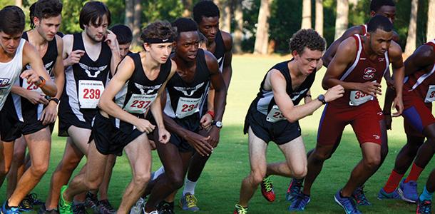 The mens cross country team gets out fast at the start of the Coastal Carolina University Invitational last Friday. 