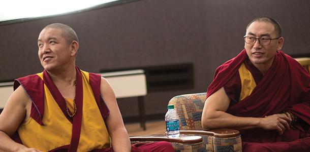 Buddhist Tibetan monks Geshe Gelek and Geshe Sangpo listen to questions from the audience in Joseph M. Bryan Jr. Auditorium. 