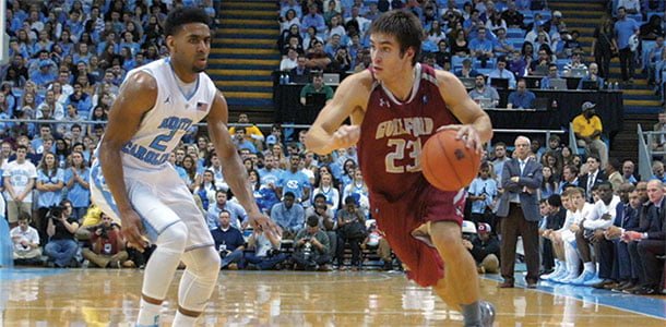 Junior guard Zachary Houston, who had 14 points and six rebounds, drives past University of North Carolinas Joel Berry.