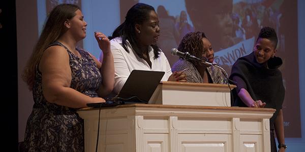 Senior Teresa Bedzigui and junior Brandee Craig stand with Patrisse Cullors and Janaya Future Khan. 