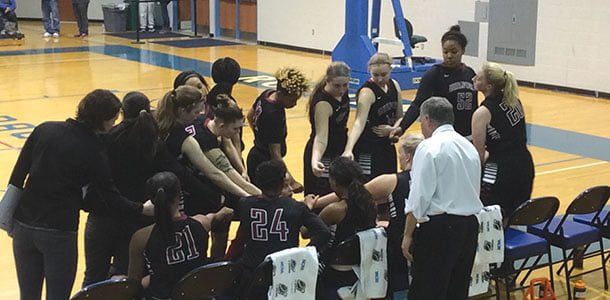 The women’s basketball team emerges from their team huddle at EMU, ready to fight until the final buzzer.