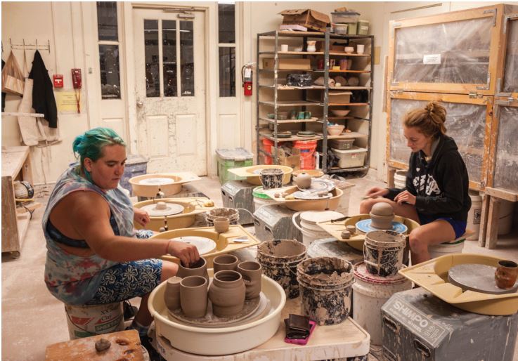 Griffin Cox ‘18 and Molly Freilich ‘16 work on a ceramics project late in the afternoon this past Tuesday, Sep. 27.