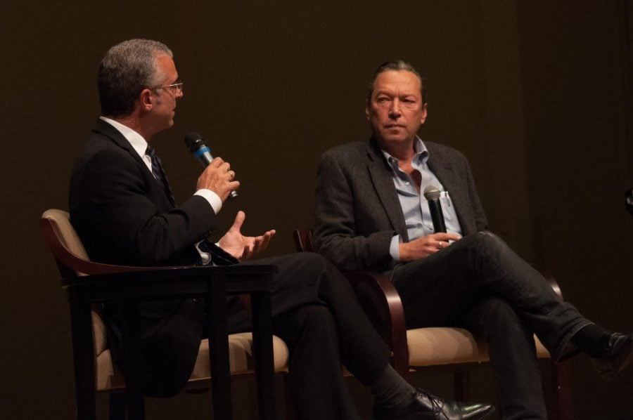 Journalist Scott Anderson, right, listens as Justin Catanoso asks him a question after Anderson presented work from his 18-month project, Fractured Lands, about the Middle East in the aftermath of the Arab spring, which ran in the New York Times magazine. 