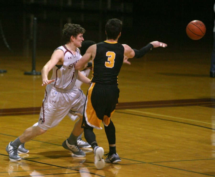 Guilford College forward Carson Long, left,guards against Randolph-Macon forward Daniel Noe in the second half of the Quakers game against the Yellow Jackets in Ragan-Brown Field House on Saturday, Feb. 11, 2017. Sophomore Long led the Quakers with 14 points. Ranked second in the conference, the Quakers beat the number-one Yellow Jackets 67-53. Photo by Andrew Walker/Copyright 2017
