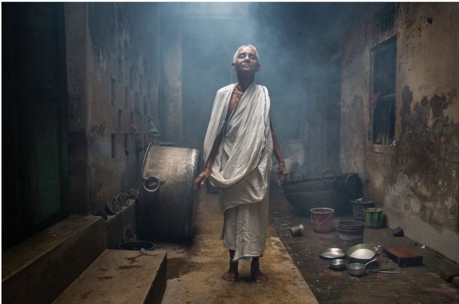 Nabadwip, West Bengal, India - April 5, 2016: Bhakti Dashi, 75 years old from Bangladesh, says she has been living in Nabadwip Bhajanashram ashram since
Bangladesh Independence around 25 years ago. Bhakti lives in the back area of the ashram, behind the temple with a few other widows. During they day other
widows come to the ashram to pray and chant in exchange for food. // Photo courtesy of Amy Toensing