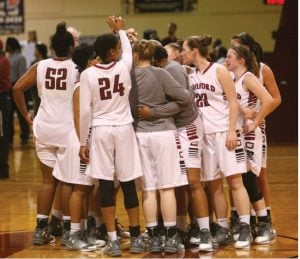 The Guilford College women’s basketball team embraces after they dropped the first round
game of the National Collegiate Athletic Association Division III Tournament against Marymount
University at the Ragan-Brown Fieldhouse in Greensboro, North Carolina, on March 3, 2017. The
Quakers trailed at halftime by 23 and came within one but fell 74-70. // Photo By Andrew Walker
