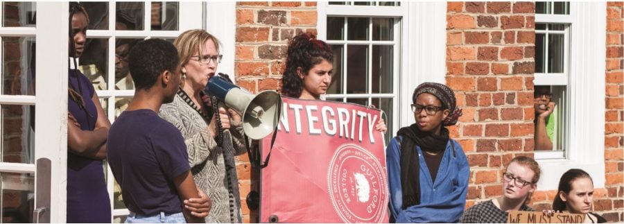 President Jane Fernandes addresses the crowd of students and protestors that gathered in response to an alleged sexual assault that was not properly handled on Wednesday, March 1, 2017 in front of Founders Hall. One month later, questions linger regarding the incident and the investigation. // Photo by Fernando Jimenez/Guilfordian
