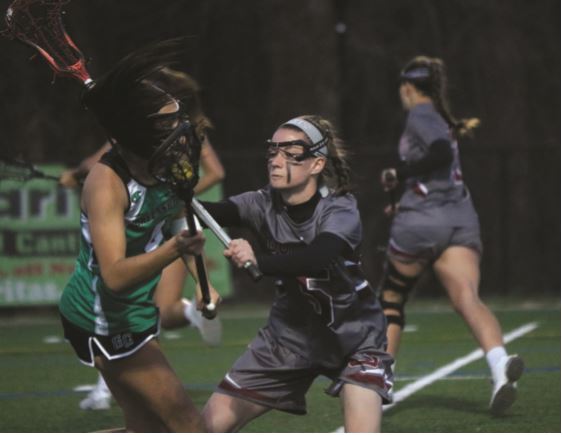 Amanda Duboi ’19 plays defense during the game against Greensboro College which took place on Wed. March 22, 2017 // Photo by Ava Nadel/Guilfordian.