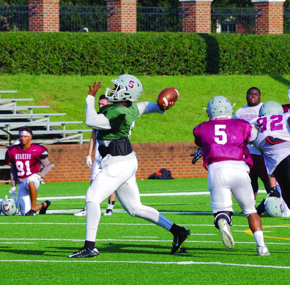 Guilford College football senior quarterback Karsten Miller passes a ball during practice on Sept. 20, 2017. Miller has 1109 passing yards and 10 passing touchdowns through three games. Photos By Andrew Walker 2017/The Guilfordian