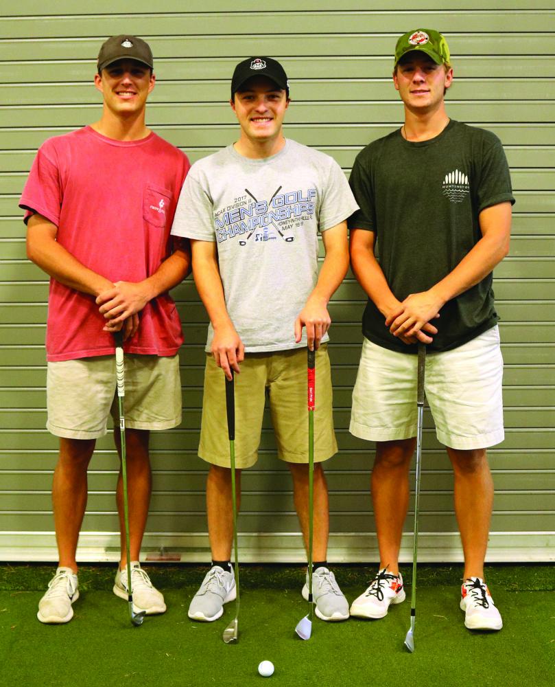 Members of the Guilford College men’s golf team Kell Graham ‘20, left, Zach Evens ‘20 and Josh Hill ‘19 pose for a portrait on Wednesday, Sept. 20, 2017. The three golfers are currently leading the conference with Hill playing an average of 69.3, Evans an average of 69.5 and Graham an average of 70.0. The men’s golf team has been ranked fourth in the nation by the NCAA Division III Bushnell magazine “Golfweek.” //Photo by Abigail Bekele/The Guilfordian