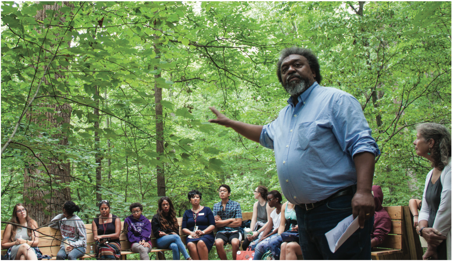 James Shields ’00, Director of the Bonner Center for Community Service & Learning, explains the significance of the Underground Railroad Tree, a 300-year old poplar tree located deep in the college’s woods.//Photo by Fernando Jimenez/The Guilfordian