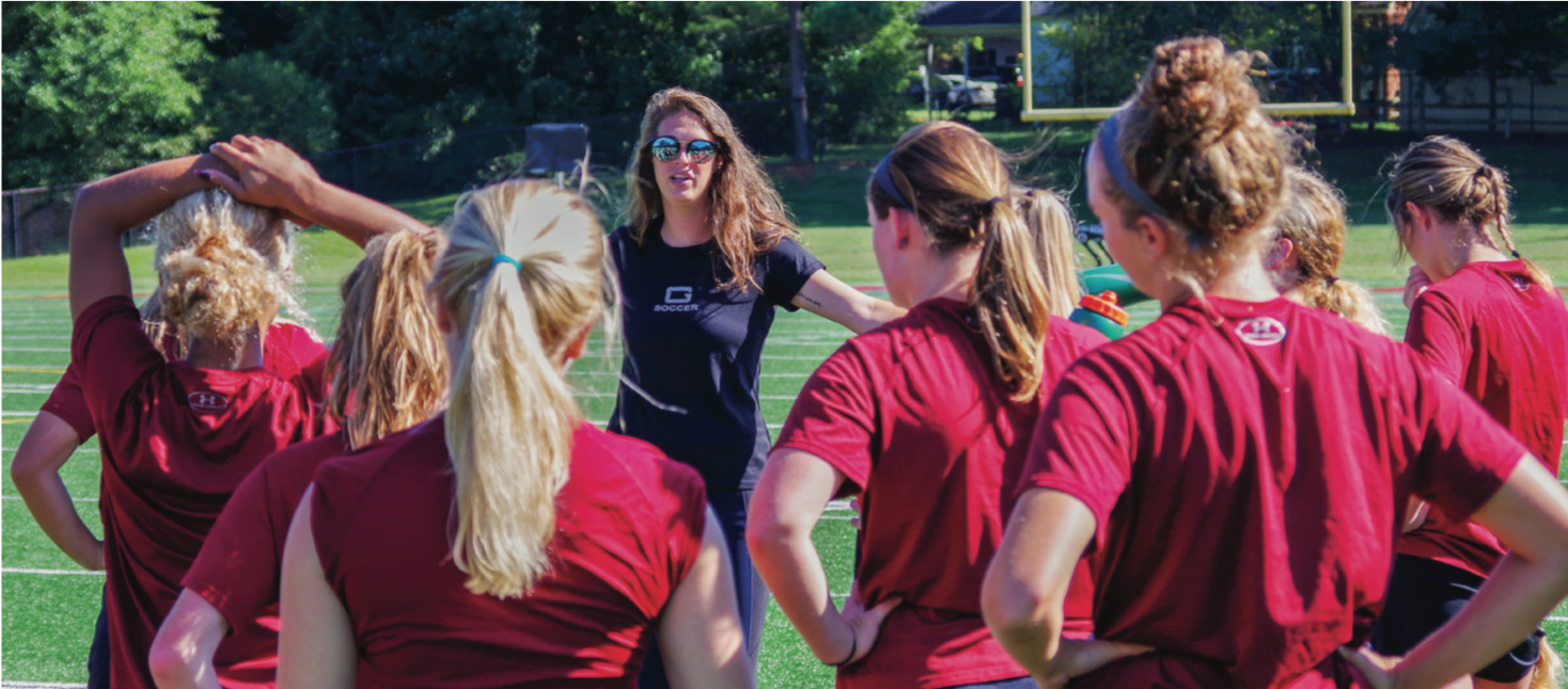 Guilford women’s soccer Assistant Coach Anna Smithers talks to the team at the start of practice in Greensboro, N.C. on Saturday, Sept. 9, 2017. This is Smithers’ second year as an assistant coach where she will work with new Head Coach Stephanie Webb.//Photo By Andrew Walker 2017/The Guilfordian