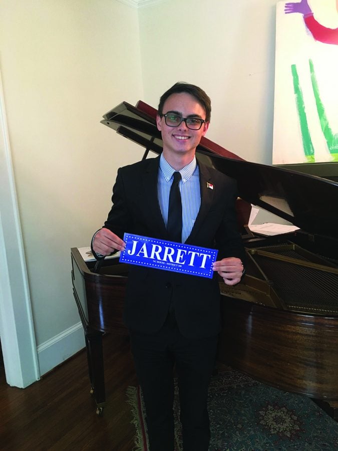 Sophomore Josh Jarrett poses with a bumper sticker from his campaign.  // Photo courtesy of Josh Jarrett