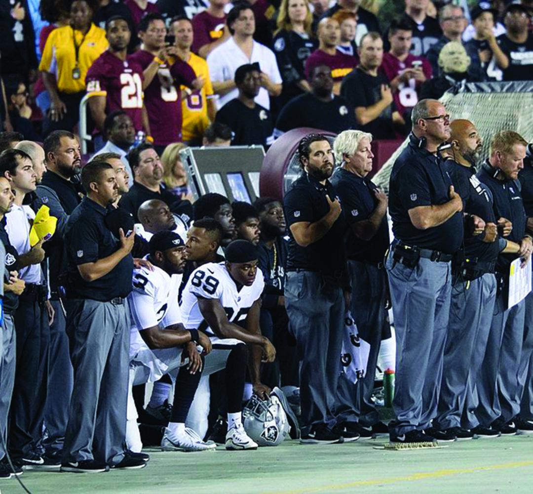 NFL players kneel during the National Anthem as a form of protest against police brutality.There were many teams that particpated in this protest. // Photo courtesy of Wikimedia Commons