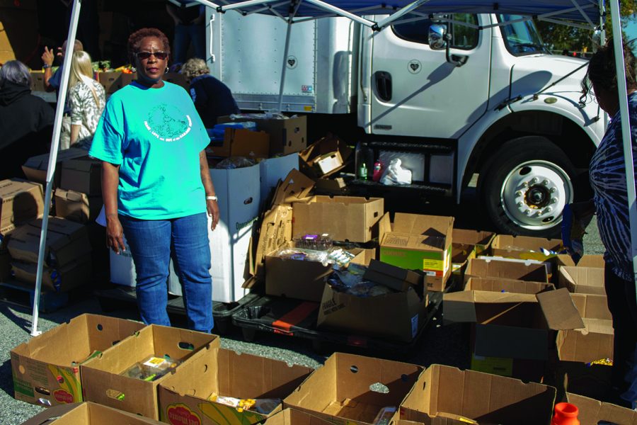 Diane Davis poses near the bread and desserts section of the Fresh Mobile Market.//Photo by Julia Martins de Sa/The Guilfordian