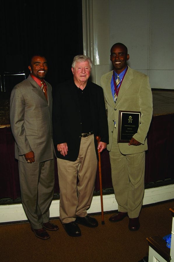 Former athletic director Herbert Appenzeller (center) stands with former Major League Baseball player Tony Womack ‘92 (left) and Guilford College football quarterback and current Associate Professor of Sport Management Calvin Hunter ‘92. Appenzeller joined Womack and Hunter as they were inducted into the 2006-2007 Guilford College Athletics Hall of Fame.//Photo courtesy Guilford Athletics.