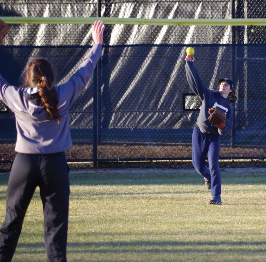 Guilford College softball sophomore outfielder Kayli Blankenship throws the ball to sophomore infielder Sarah Adams at practice on Feb. 2, 2018.//Photo By Andrew Walker/The Guilfordian 