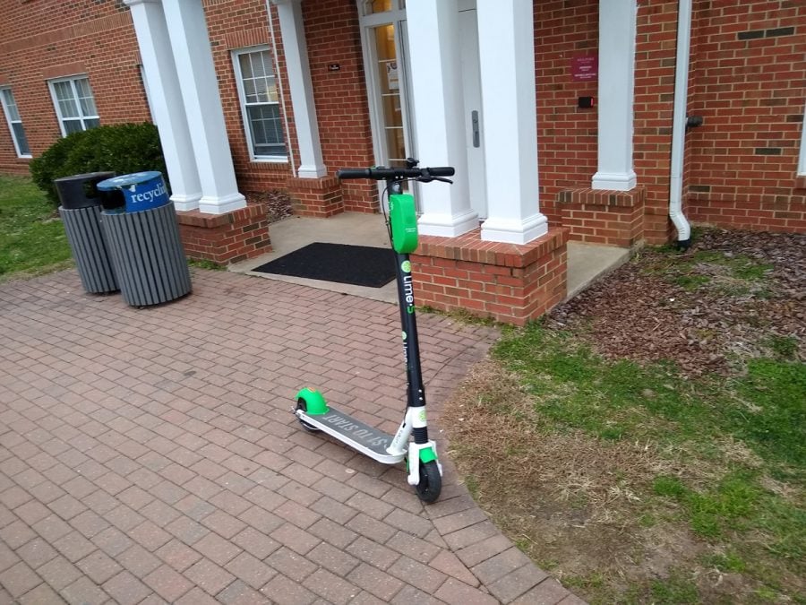 A Lime-S electric scooter sits outside of the South Apartments. The scooters are part of a pilot program by the City of Greensboro.//Photo By Andrew Walker/The Guilfordian 