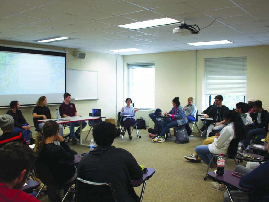 Professor+Karen+Spira+speaks+to+the+group+about+upcoming+study+abroad+opportunities+available+through+Guilford.