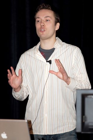 An image of David Hansson, a programmer, speaking at a tech conference in California.