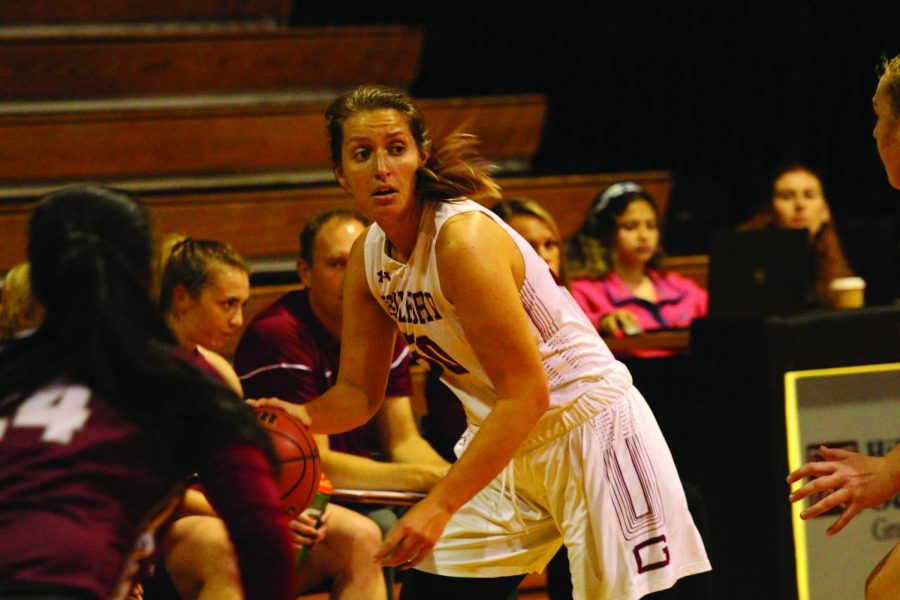 Junior Julie Carini searches for an open teammate in a Nov. 4 scrimmage. 