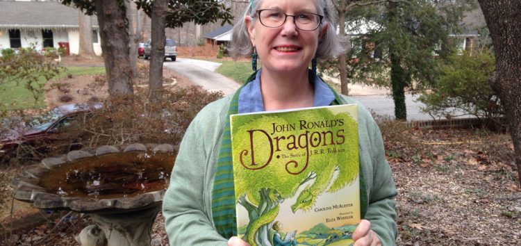 Professor Caroline McAlister holds another book she wrote in 2017, titled “John Ronald’s Dragons.” 