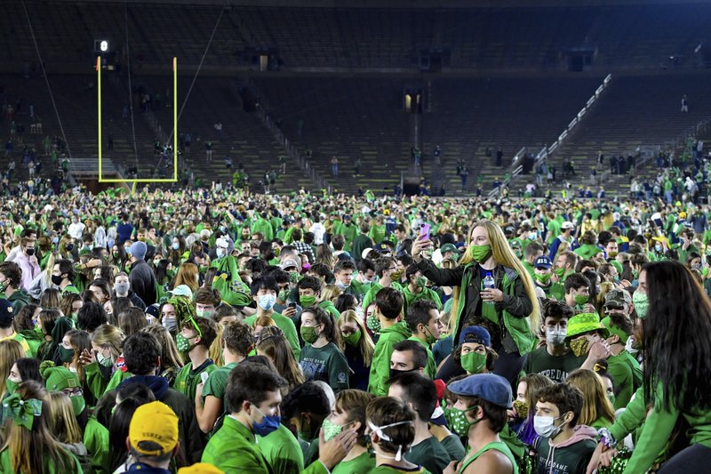 Thousands of fans rush the field after Notre Dame’s victory against Clemson. 