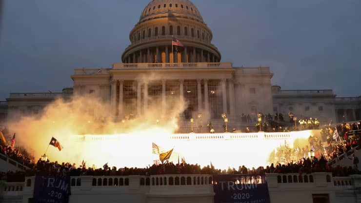 An explosion caused by a police munition is seen while supporters of U.S. President Donald Trump gather in front of the U.S. Capitol Building in Washington, U.S., January 6, 2021