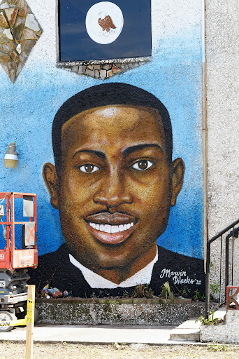 A mural depicting Ahmaud Arbery is painted in Brunswick, Georgia.