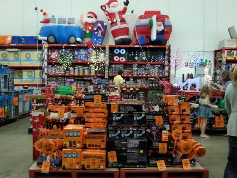 Halloween and Christmas decorations side by side in a store