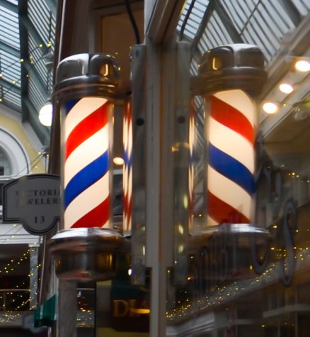 An American barber pole. In Europe, the poles are just red and white, while in America they include blue, for unclear historical reasons.