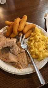 Stameys Barbecue in Greensboro serves delicious classics, like this sliced barbecue served with homemade hushpuppies and mac and cheese.