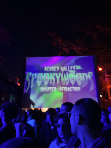 When visitors arrive at the line to enter the first of Spookywoods’ 15 haunted areas, they find themselves at “Club Spooky.” Here, a DJ hypes up the crowd with loud music while scare actors creep through the shadows. 