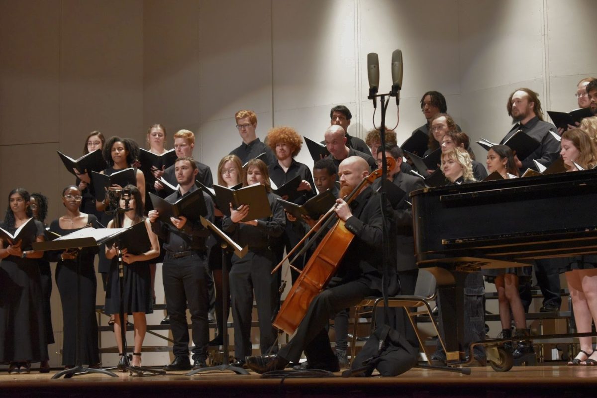 Guilford Cello Professor Peter Swanson plays with the Guilford College Choir during the music department’s annual spring concert on April 6.
